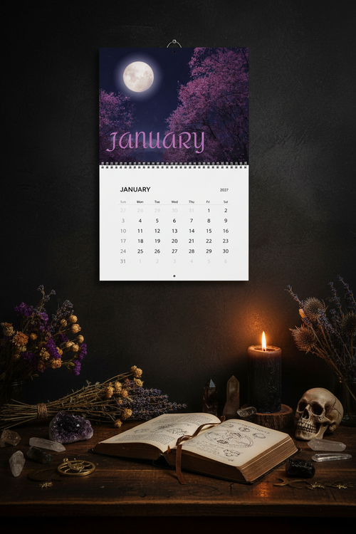 2027 Moon Lover's Calendar on a dark moody desk with crystals and candlelight